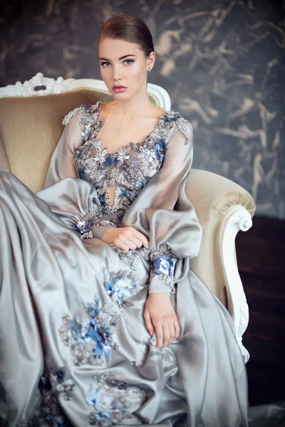 lady in silver dress