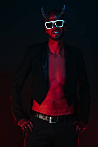 A portrait of a bad demon in sunglasses. Horror movie, nightmare. Halloween.