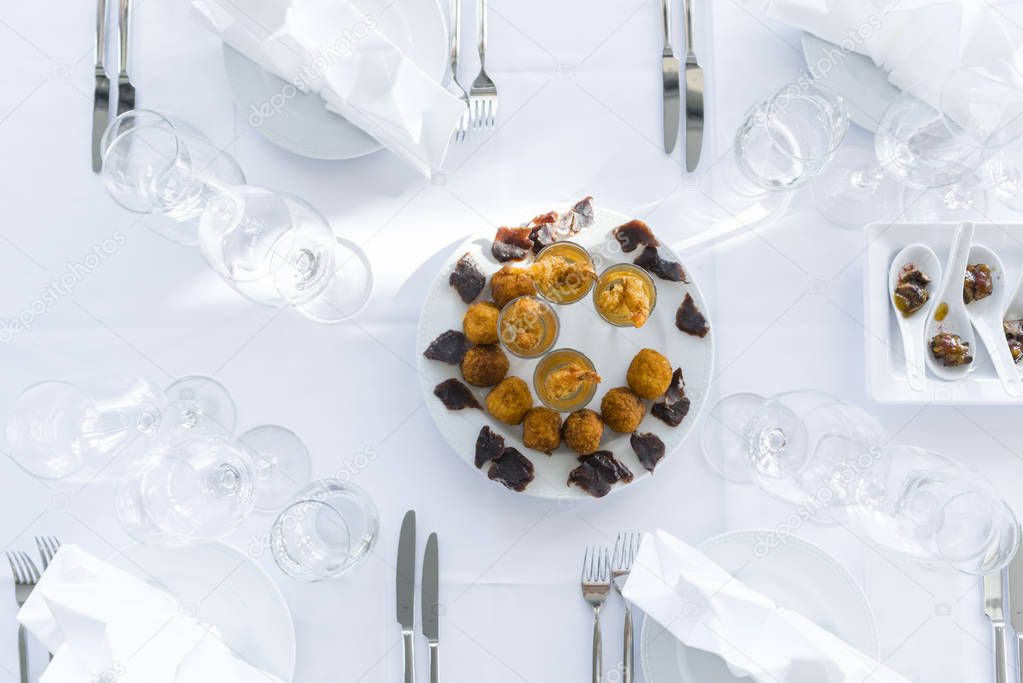 Top view of an appetizer plate on a table in a restaurant. Stylish food