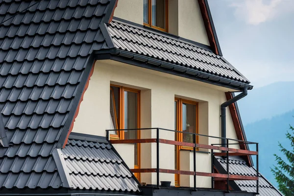 element of a villa architecture balcony and a roof close up