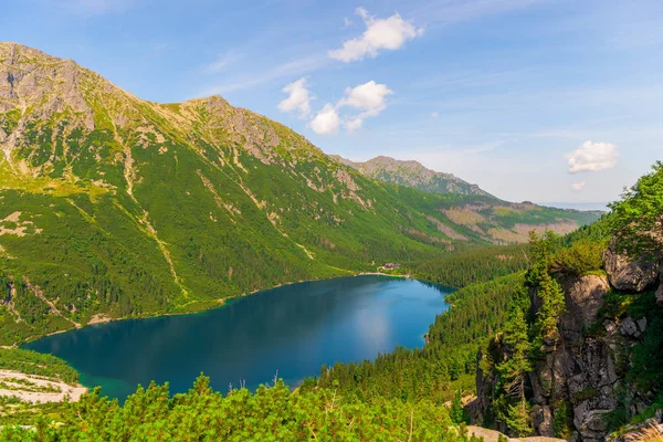 stock image View from the mountain to the beautiful scenic Lake Morskie Oko on a sunny summer day