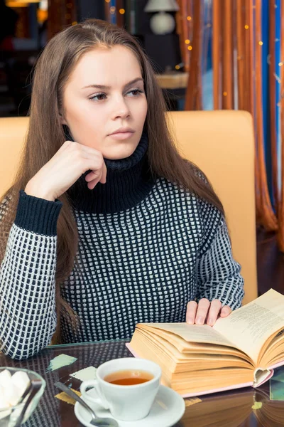 Girl Book Pondered Table Cafe Looks Out Window — Stock Photo, Image