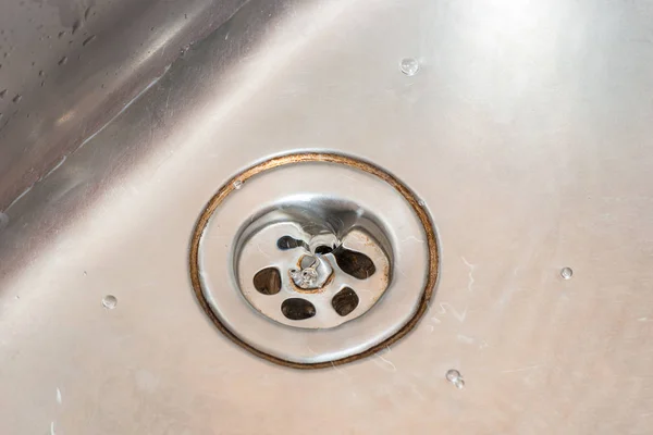 Dirty stainless sinks in the kitchen closeup