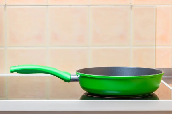 Green Frying Pan Closeup Glass Ceramic Stove — Stock Photo, Image