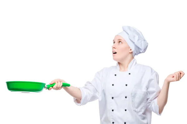 Cook throws up food in a frying pan, emotional portrait on a whi — Stock Photo, Image