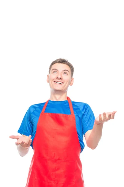 Porträtt av en man i ett förkläde som jugglar utrymme för objekt på t — Stockfoto