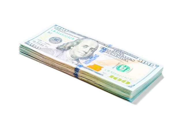 Pilha de notas de 100 dólares empilhados em fundo branco isolado — Fotografia de Stock