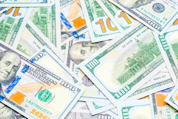 A pile of 100 dollar bills close up in a chaotic manner — Stock Photo, Image