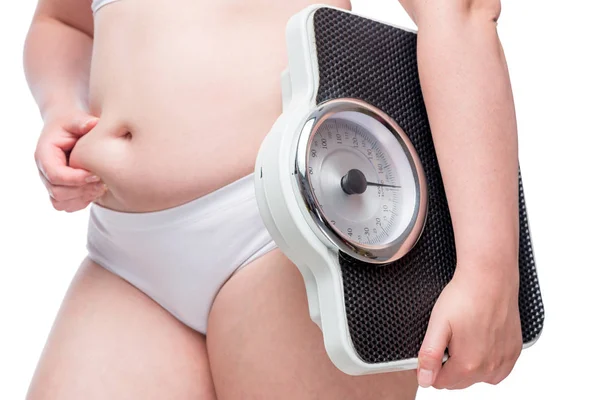 Female body is fat, in the hands of scales, the concept is time — Stock Photo, Image