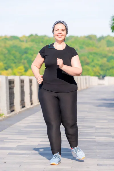 Portrait of a fat active woman working on her figure - morning r — Stock Photo, Image