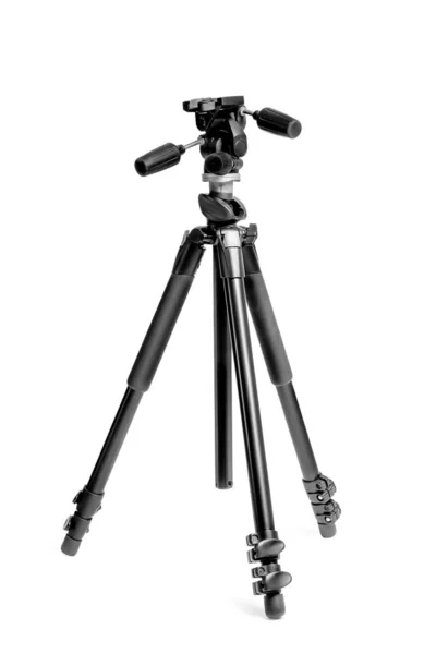 Trípode para cámara fotográfica en estudio fotográfico sobre fondo blanco clos — Foto de Stock