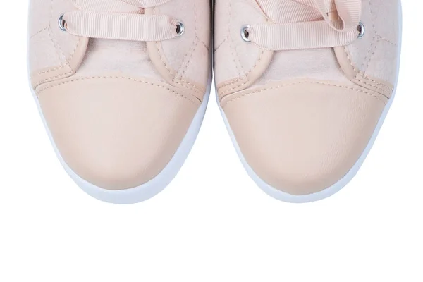 Women's pink canvas sneakers with beads close-up toe on a white — Stock Photo, Image