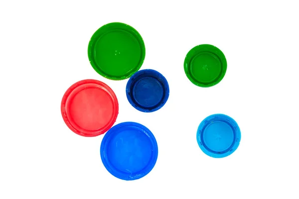 Kunststof Dop Geïsoleerd Witte Achtergrond Rode Blauwe Groene Deksels Bovenaanzicht — Stockfoto