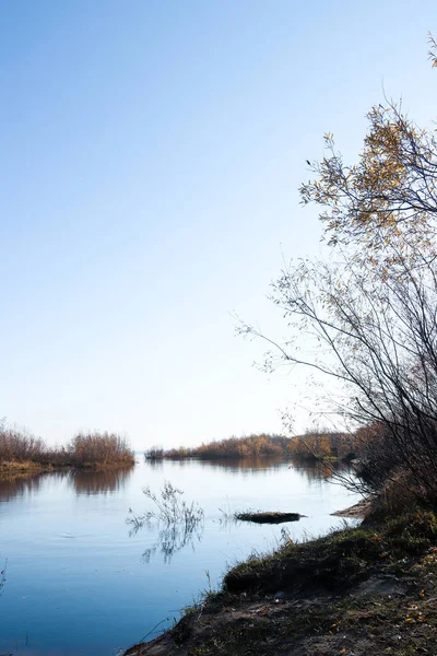 Autumn day in Arkhangelsk. Island Krasnoflotsky. the reflection — Stock Image Autumn day in Arkhangelsk. Island Krasnoflotsky. the reflection Royalty Free Stock Images