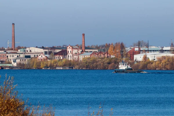 Arkhangelsk. Autumn day. View of the old buildings and berths of — Stock Image Arkhangelsk. Autumn day. View of the old buildings and berths of Royalty Free Stock Photos