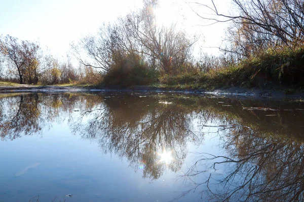 Autumn day in Arkhangelsk. Island Krasnoflotsky. the reflection — Stock Image Autumn day in Arkhangelsk. Island Krasnoflotsky. the reflection Stock Photo