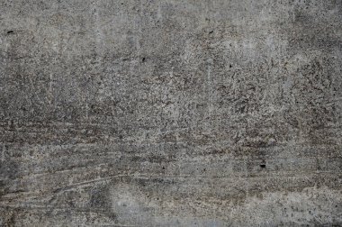 Beton closeup doku. Gri arka plan şeritler, çatlak ve küçük delikler ile dokulu.