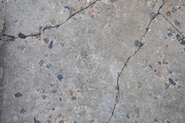 Doku eski beton. Çatlak ve hasar. Gri beton zemin.