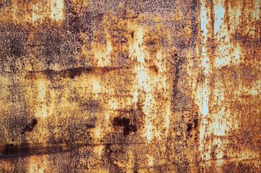 Pas. Doku ve arka plan eski paslı metal levha. Paslı demir, çizikler ve boya kalıntısı ile.