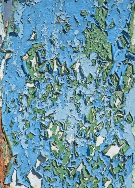 Arka plan doku eski paslı bozuk metal. Bir saç çok renkli boya kalıntıları.