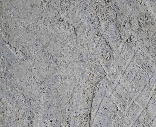 Сірий бетон текстури фону. Тріщини. Подряпини. Пошкодження. тріснутий кам'яний фон стіни . — стокове фото