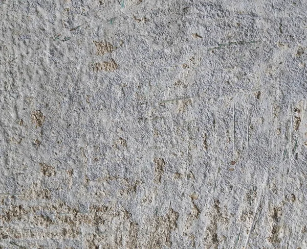Grijze betonnen textuur achtergrond. Scheuren. Krassen. Schade. Gebarsten stenen muur achtergrond. — Stockfoto