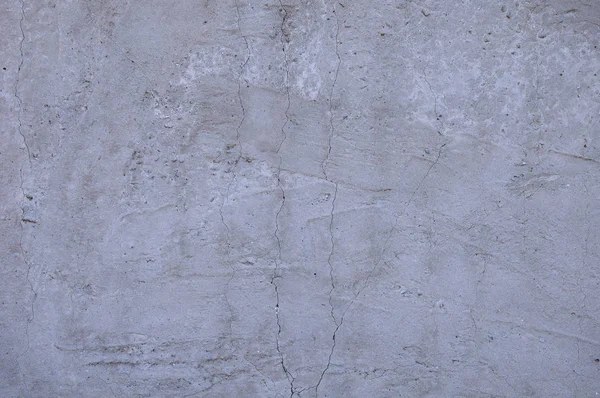 Grijze betonnen textuur achtergrond. Schade. Gebarsten stenen muur achtergrond. — Stockfoto