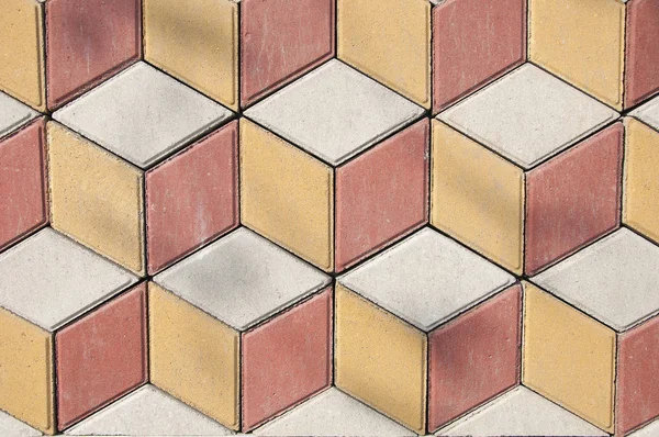 Текстура и фон камня. Желтые и красные с мощеной плиткой. Геометрический орнамент . — стоковое фото