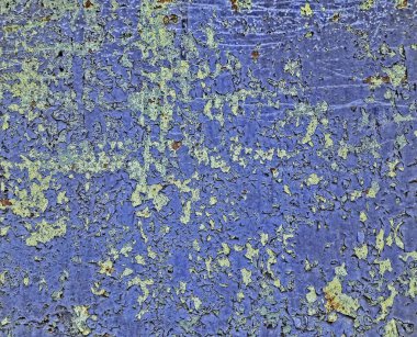 Arka plan doku eski paslı bozuk metal. Bir saç çok renkli boya kalıntıları.