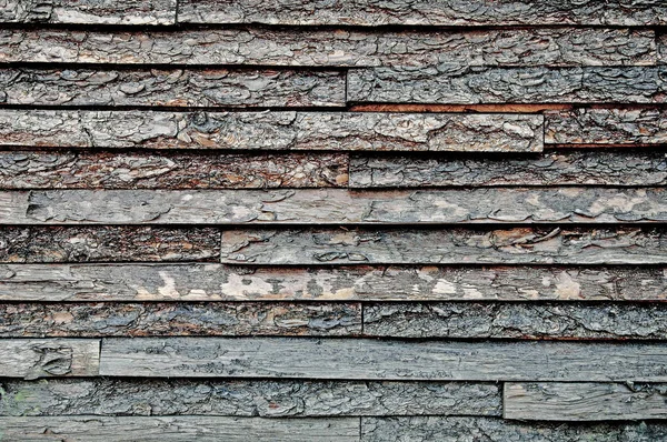 The texture of the background of wooden planks. Side view. Close-up.