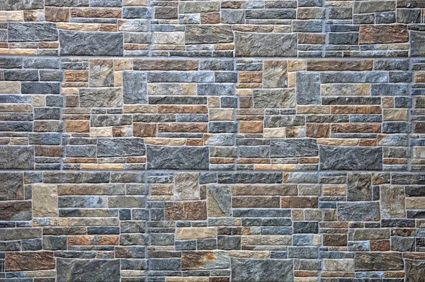 The textures of natural stone. Wall and stone background. Interior background of a stone. Design modern. Stones texture.