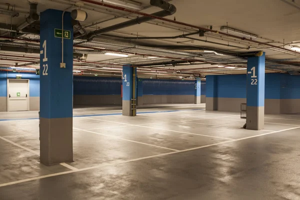 underground parking spaces in blue