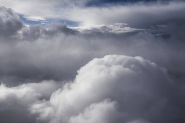 clouds from great height with blue sky background clipart