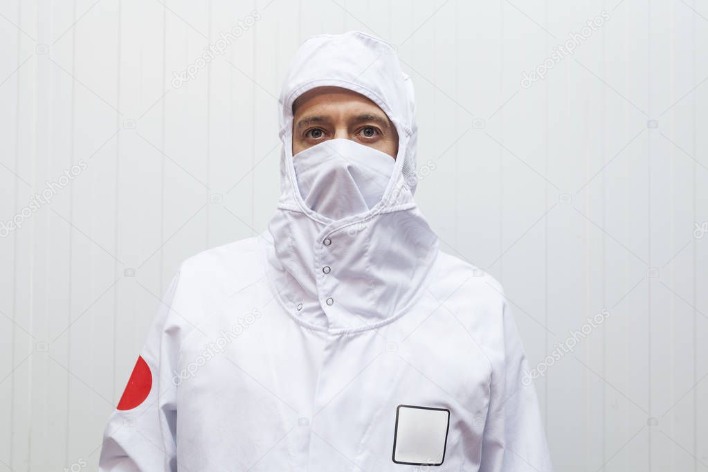 close-up portrait of worker man with hygienic work clothes under regulations