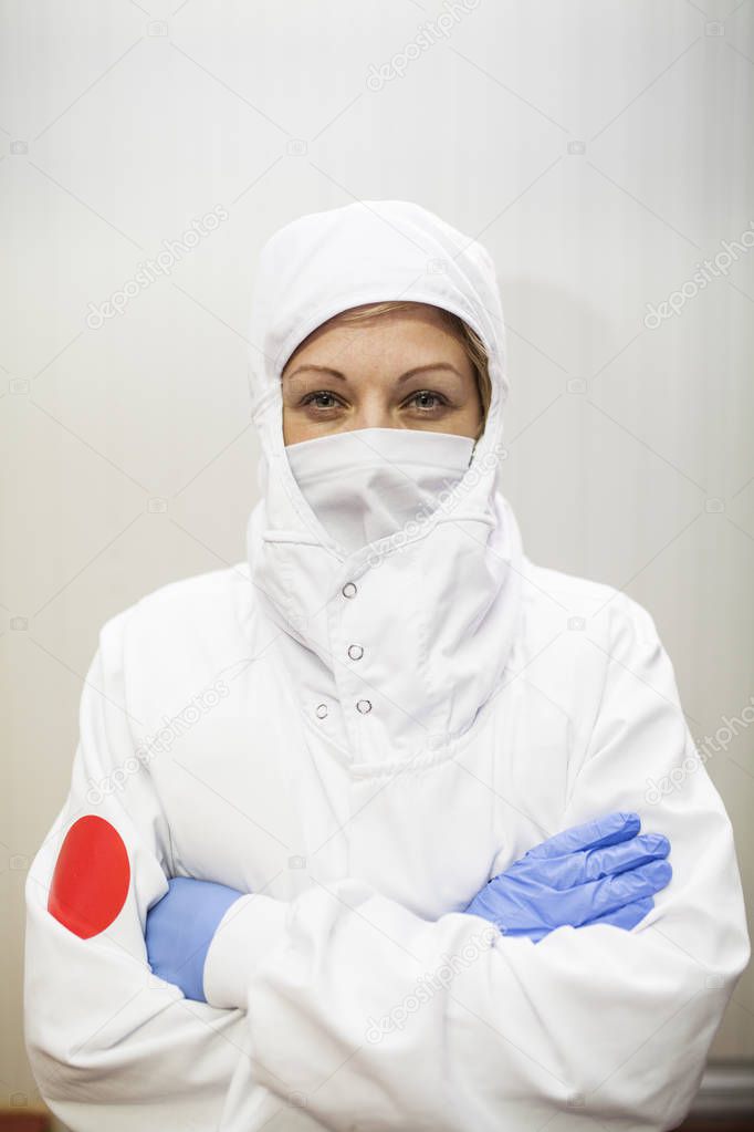 close-up portrait of worker woman with hygienic work clothes under regulations