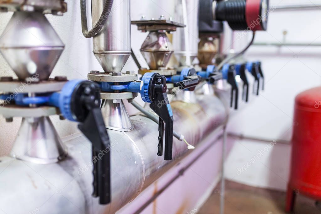 water cutting levers in an industrial hot water installation