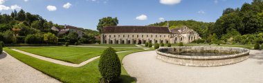 Fontenay, France - July 31, 2018: Panorama of the garden of the romanesque, Cisterian abbey, Cote-d'Or, France. clipart