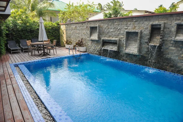 Swimming pool of hotel.Beautiful luxury outdoor swimming pool with stair in hotel and resort for holiday travel and vacation
