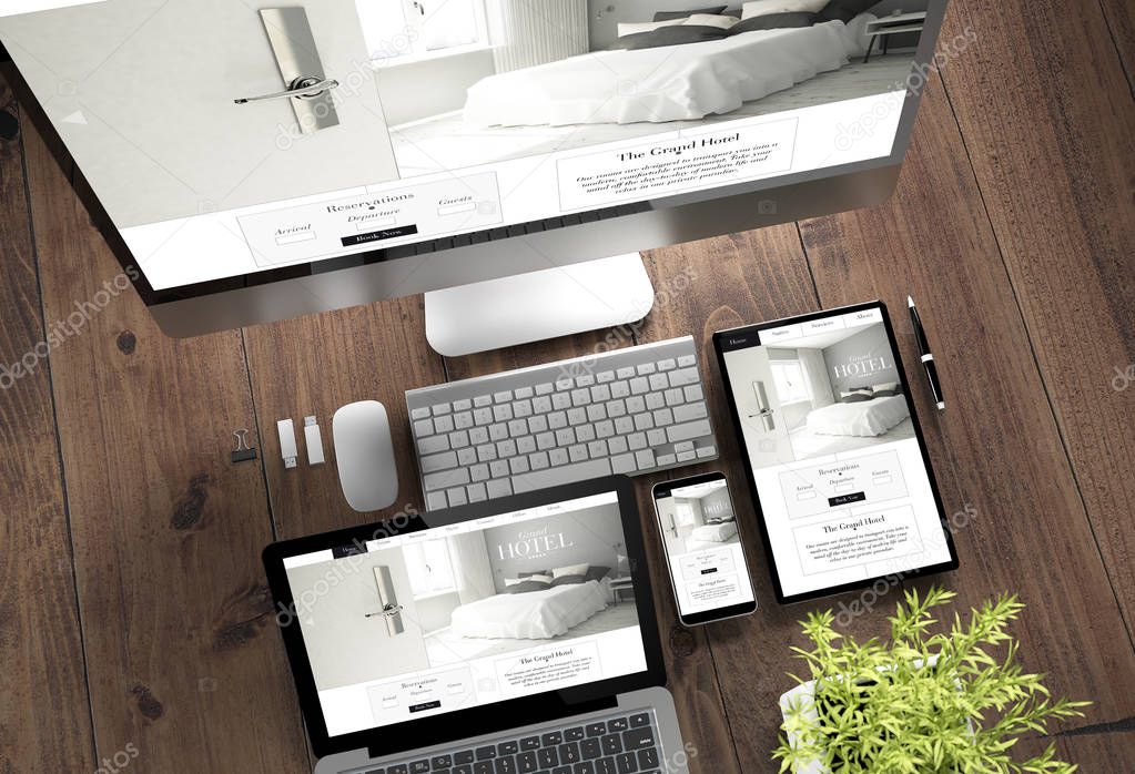 3d rendering top view of devices with grand hotel on screen on wooden desktop