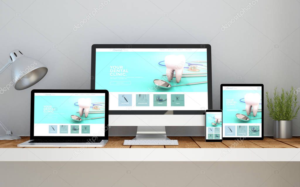 computer, laptop, smartphone and tablet on desktop workspace with dental clinic online responsive website on screen