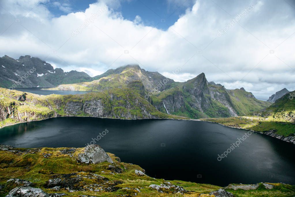 View from mountain to sea and black lakes on the Lofoten island