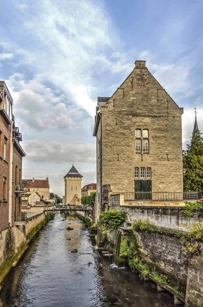 A spectacular sky over the old town of Valkenburg, The Netherlands, where the river Geul flows through marlstone banks and buildings