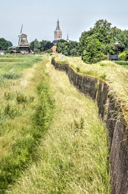 Hazne, bir tuğla duvar, o fotoğraftan floodlands ve Hasselt, Hollanda yakınındaki polder ile takviye