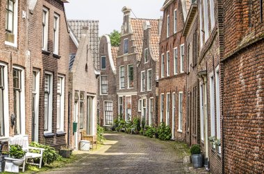 Blokzijl, The Netherlands, June 9, 2018: well-preserved ancient houses in Kerkstraat in the old town clipart