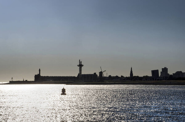 The skyline of Vlissingen (Flushing) The Netherlands, including the lighthouse, the Orange Windmill, Saint Jacob's Church and the Arsenal Tower