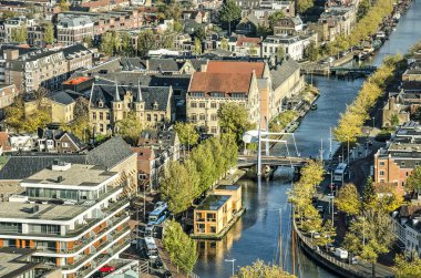 Leeuwarden, The Netherlands, November 3, 2018: aerial view of Zuiderstadsgracht canal and Blokhuispoort, a former prison complex redevelpoed into cultural centre clipart