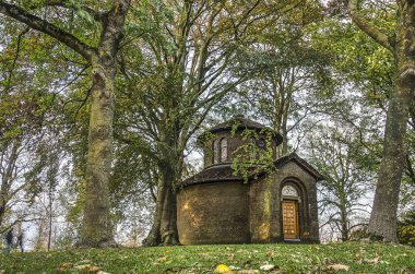 Leeuwarden, The Netherlands, November 3, 2018: small temple envisioned by local sculptor Pier Pander and built in 1924 in the park on the city's ramparts clipart