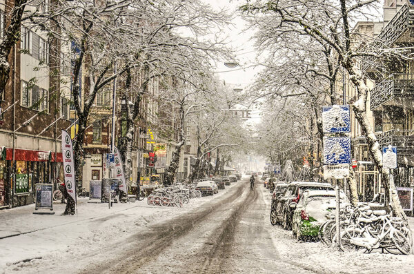 Rotterdam, The Netherlands, December 10, 2017: View along downtown Witte de Withstraat after de-icing salt and traffic have turned recently fallen snow into a grey brown slush