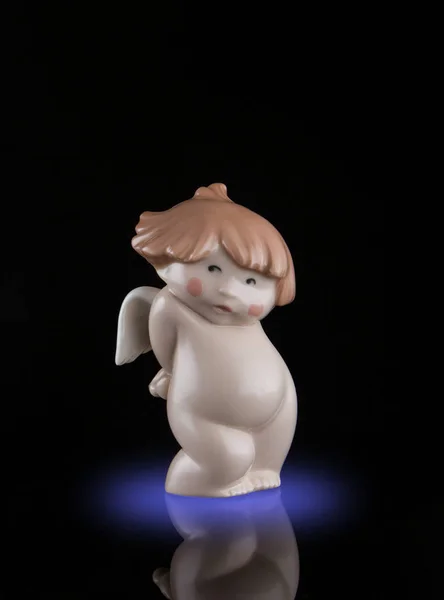 Close-up statue of the little porcelain angel figurine