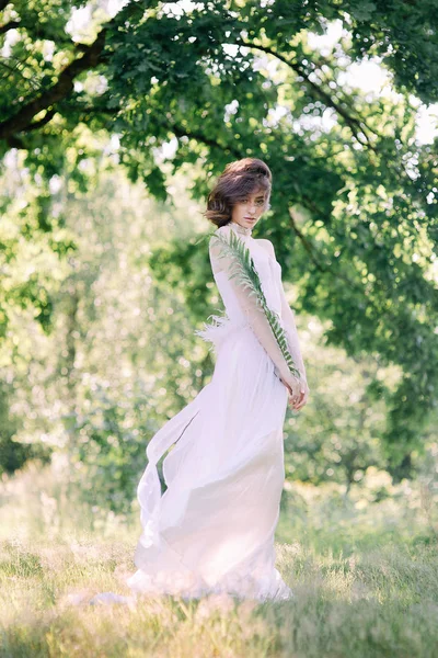 Fashion young lady wearing elegant white dress — Stock Photo, Image